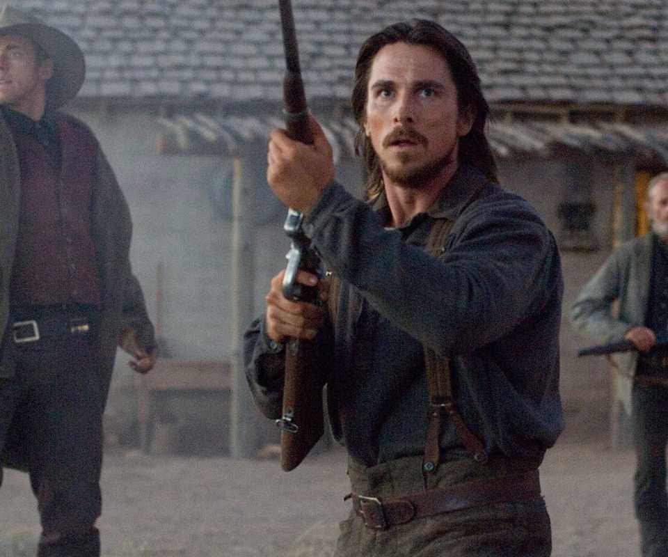 Christian Bale with a rifle in 310 to Yuma