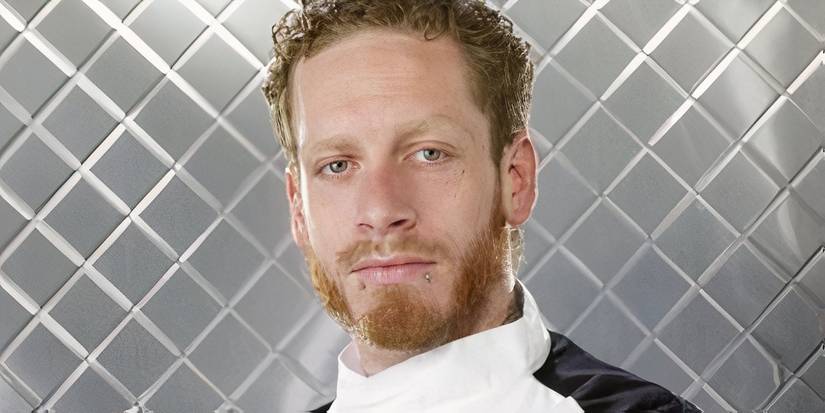 Close up of Charlie McKay from Hell's Kitchen season 5 in front of a metal background