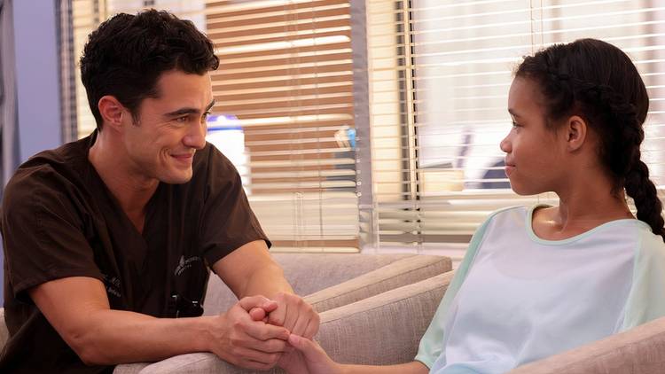 Darren Barnet as John Frost comforting a patient in Chicago Med season 10 premiere