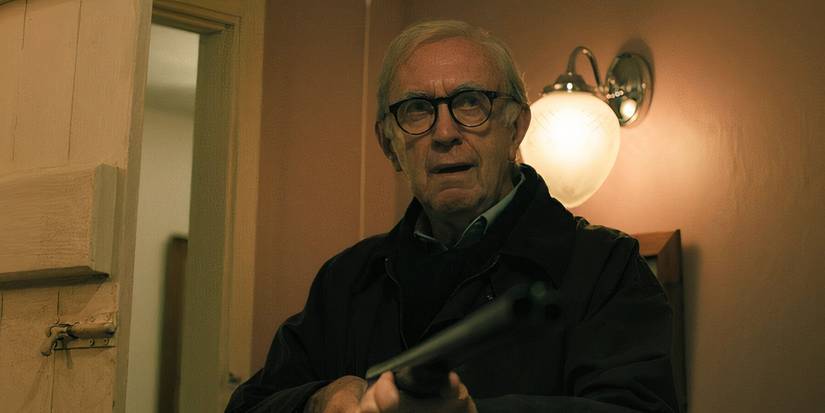 David Cartwright (Jonathan Pryce) levels his shotgun at an intruder in Slow Horses season 4, ep 1