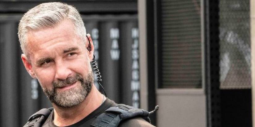 Deacon (Jay Harrington) smiling in SWAT.