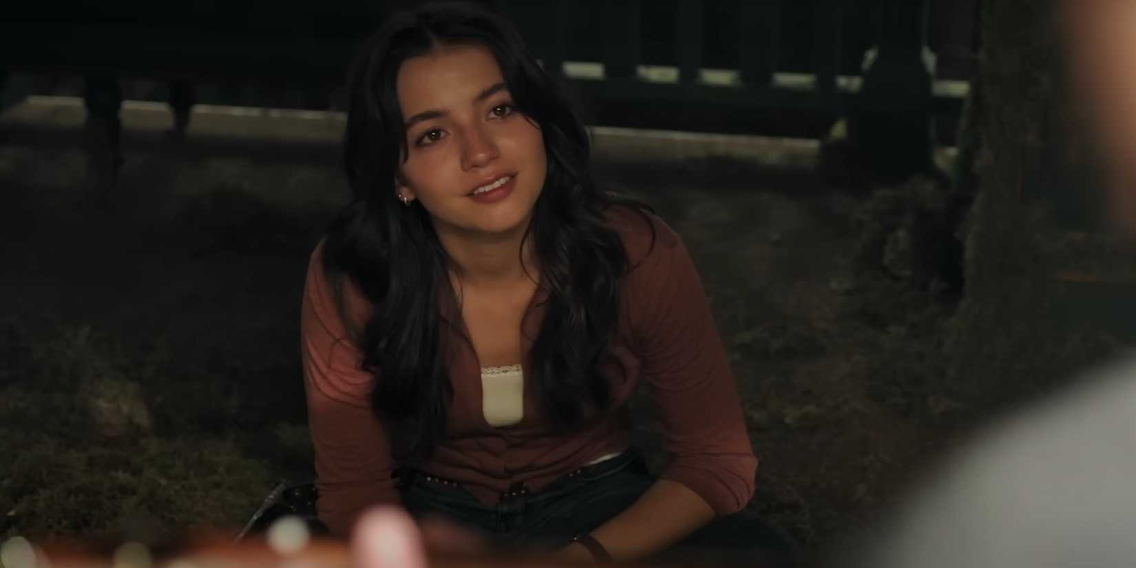 Dina watching Ellie play guitar in The Last of Us