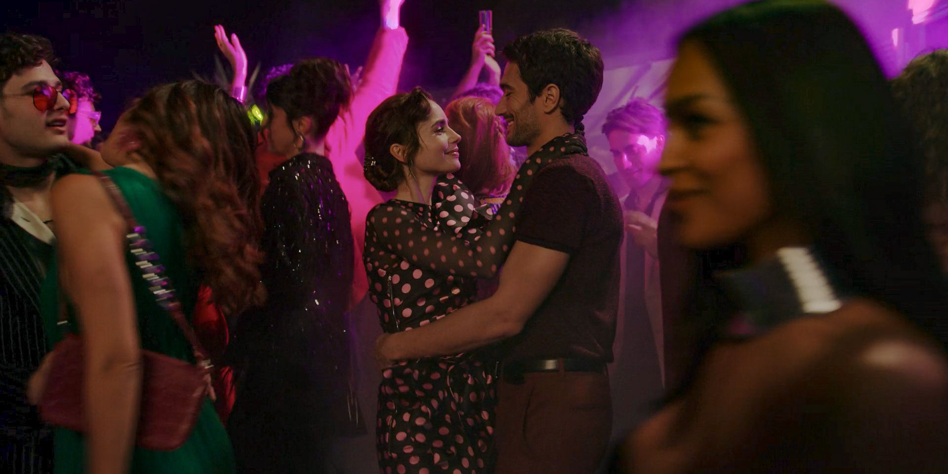 At a party in Rome, Emily (Lily Collins) and Marcello (Eugenio Franceschini) dancing in Emily in Paris Season 4 Episode 9