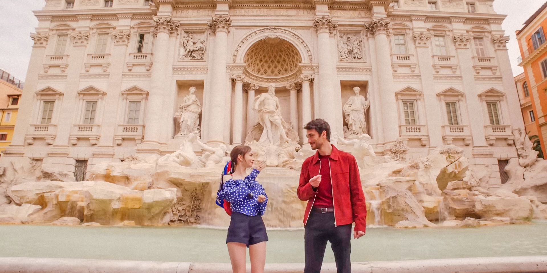 Emily (Lily Collins) and Marcello (Eugenio Franceschini) making a wish at the Fontana di Trevi in Emily in Paris Season 4 Part 2 trailer