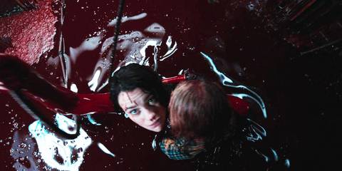 Evil Dead Rise Beth and Kassie in the elevator filled with blood