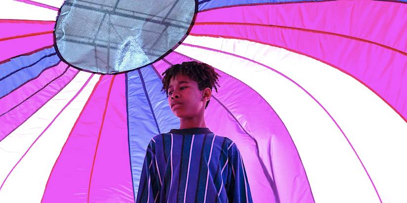 Ian Foreman's young Owen stands under a tent in I Saw the TV Glow