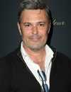 Headshot Of Carlos Bernard