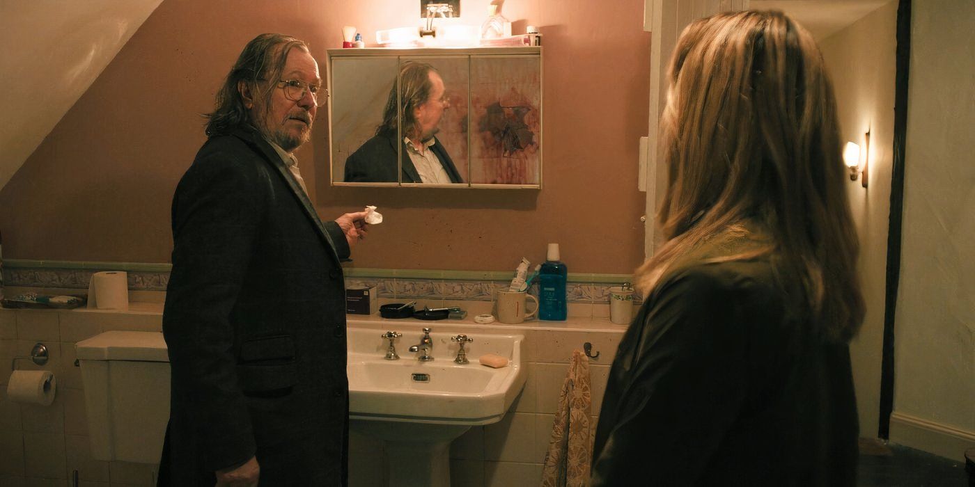 Jackson Lamb (Gary Oldman) speaks with Emma Flyte at the scene of River's apparent murder in Slow Horses season 4, ep 1