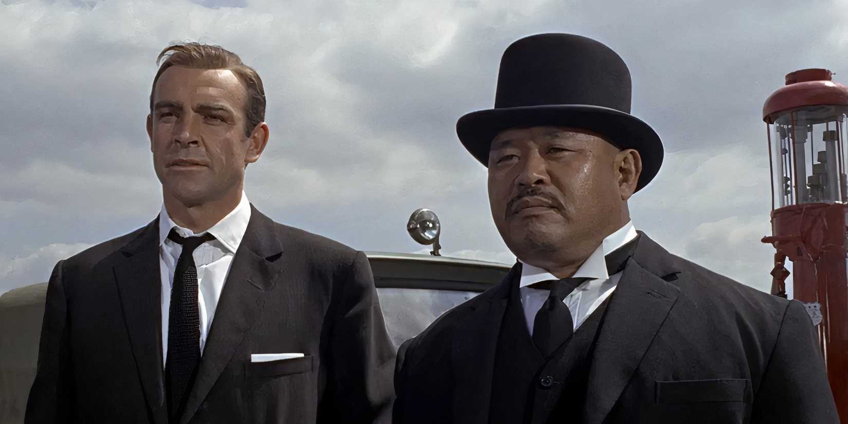 Sean Connery and Harold Sakata as James Bond and Oddjob in Goldfinger
