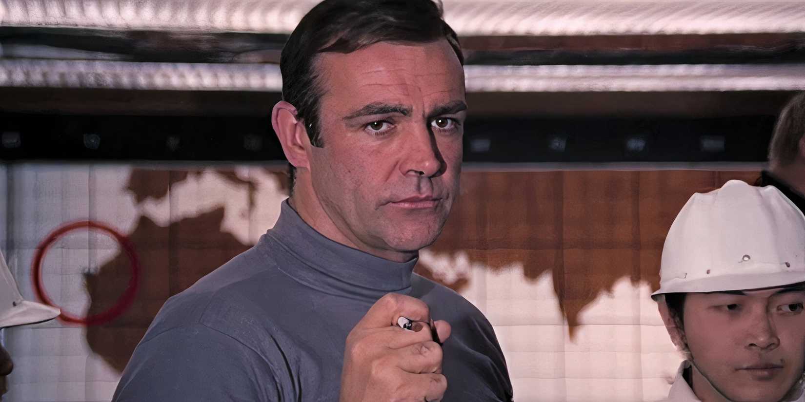 James Bond (Sean Connery) holding a rocket launching cigarette