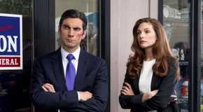 Jamie Dutton (Wes Bentley) and Christina (Katherine Cunningham) standing together outside Jamie's office in Yellowstone.