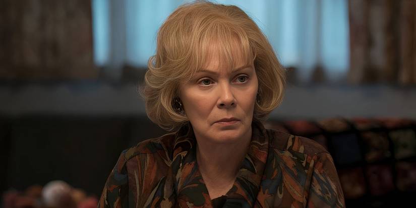 Jean Smart as Helen sitting at the table in Mare of Easttown