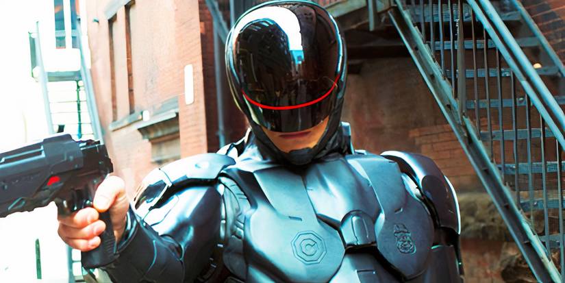 Joel Kinnaman apontando uma arma como RoboCop no reboot de RoboCop de 2014