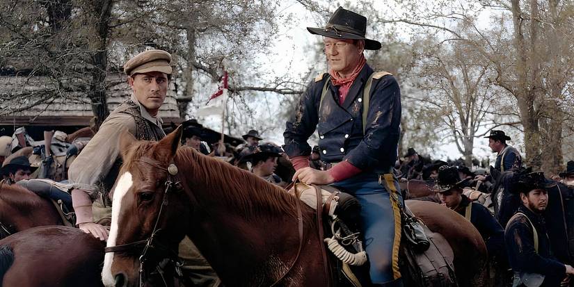 John Wayne e Ken Curtis a cavalo nos soldados de cavalo