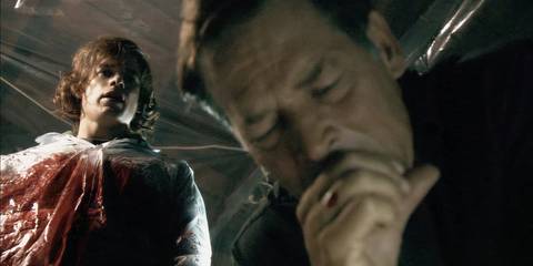 Dexter (Michael C. Hall) watches as Harry Morgan (James Remar) vomits in Dexter season 2, episode 10