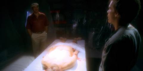 Miguel Prado (Jimmy Smits) watches as Dexter Morgan (Michael C. Hall) butchers Juan Ryness' body in Dexter season 3, episode 7