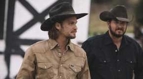 Kayce (Luke Grimes) and Rip (Cole Hauser) working together in Yellowstone.