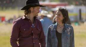 Kayce (Luke Grimes) smiling at Monica (Kelsey Asbille) in Yellowstone.