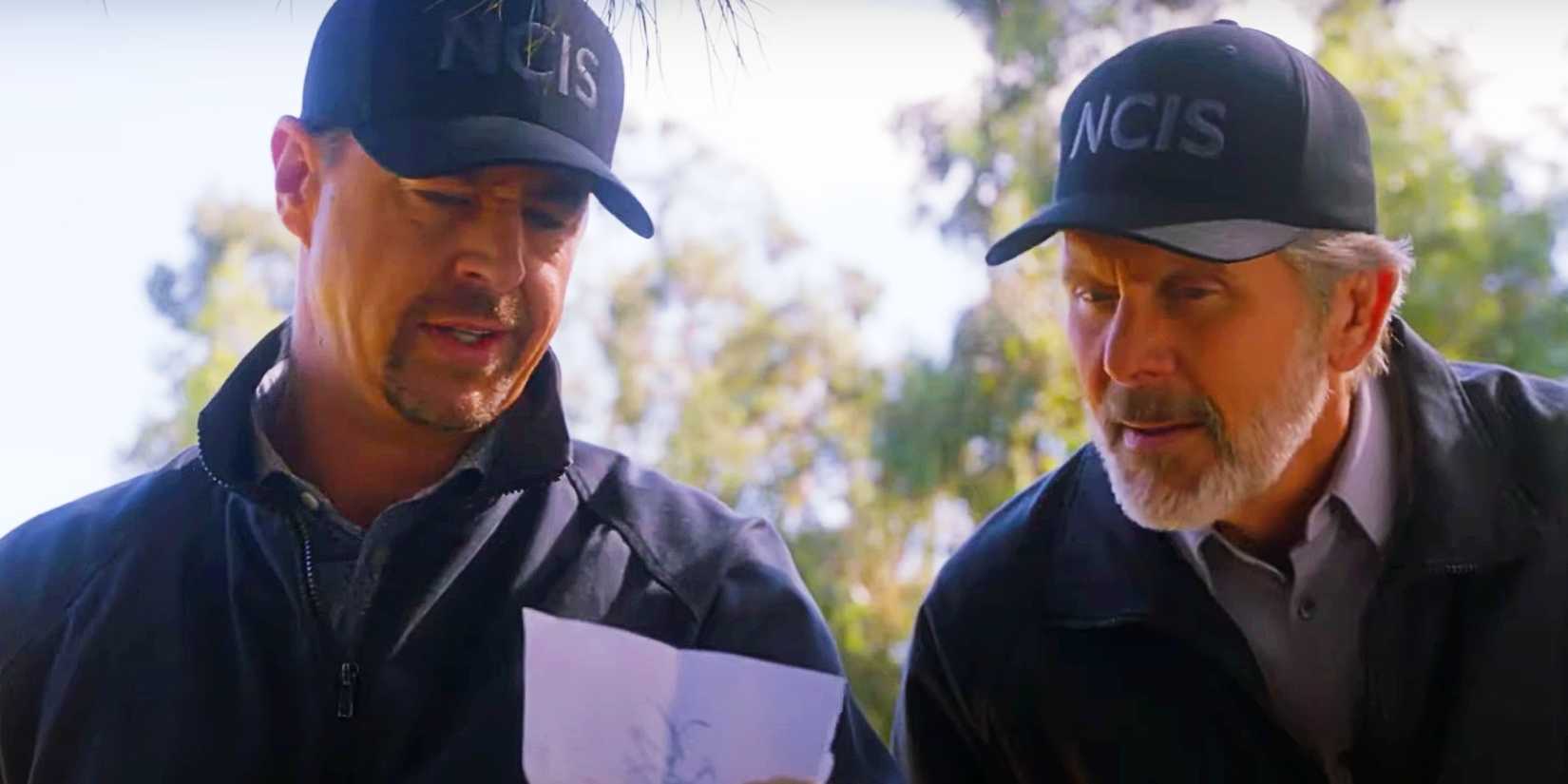 CBS Officially Ends NCIS After 34 Years 1 McGee and Parker study a piece of paper in NCIS season 22