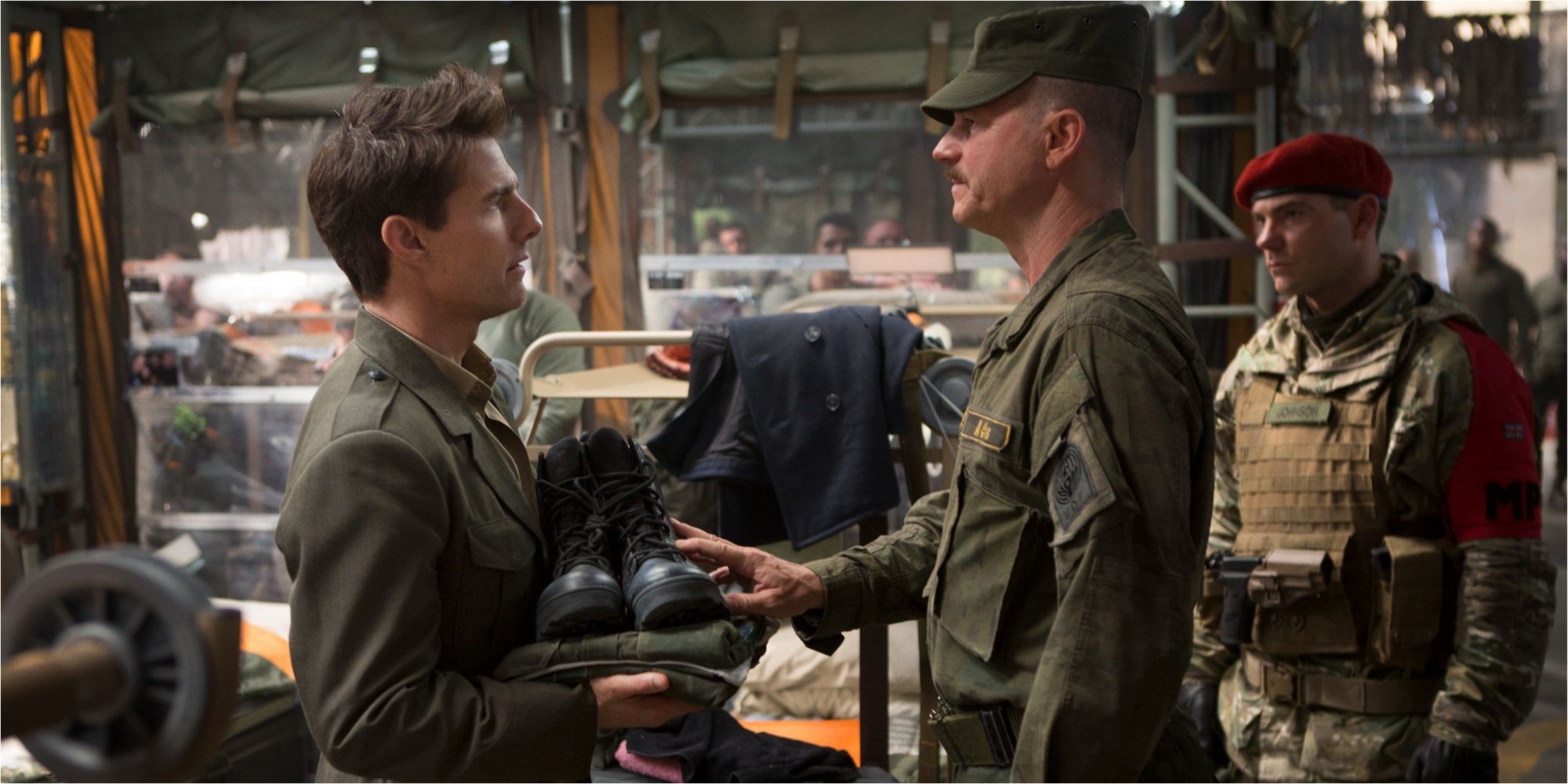 Tom Cruise and Bill Paxton staring at each other in Edge of Tomorrow