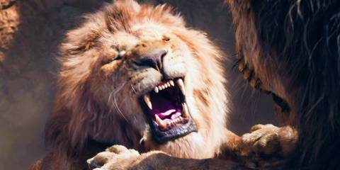 Mufasa yelling in pain and hanging from a cliff in The Lion King 2019