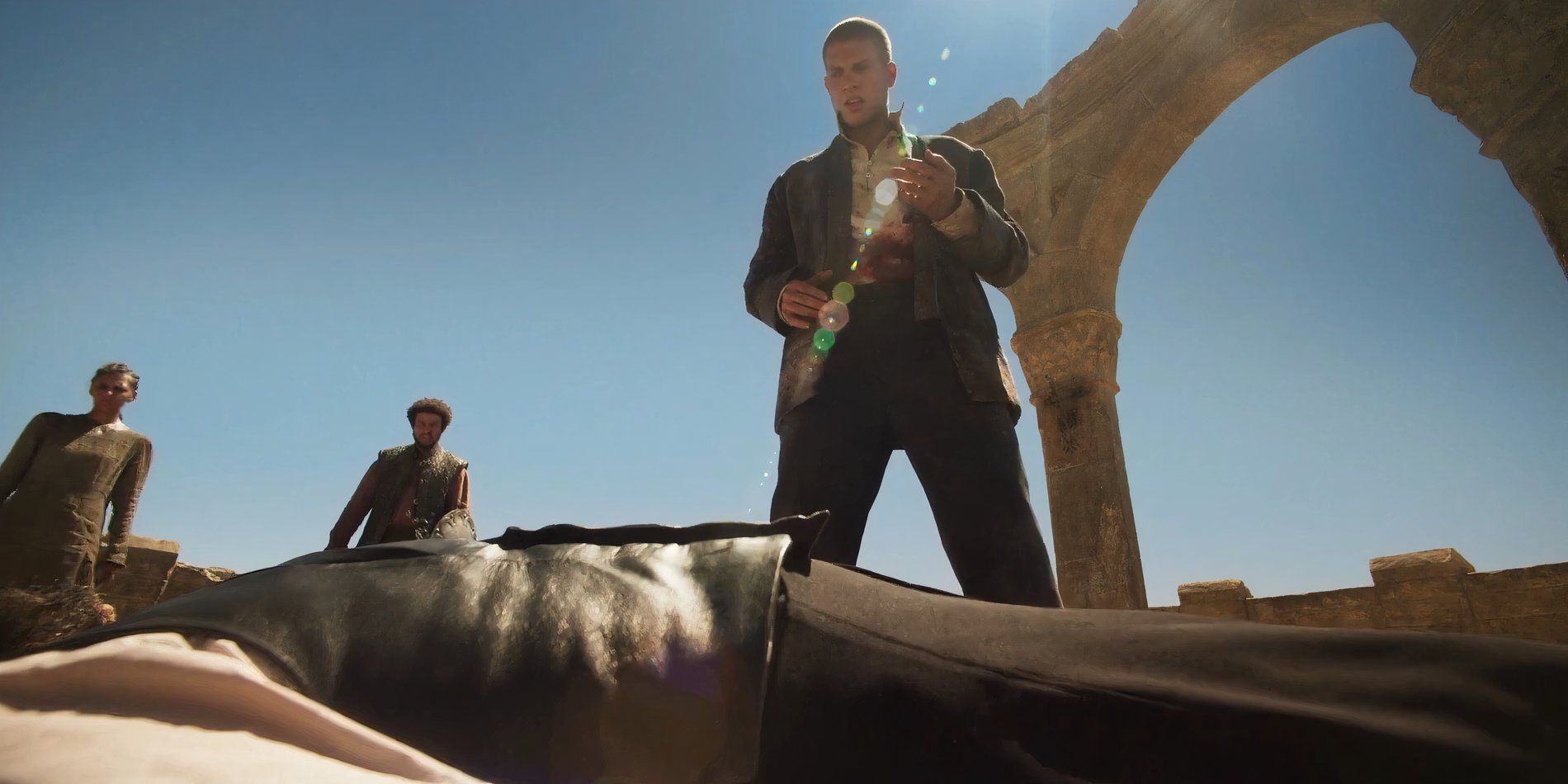 Rand al'Thor looking over Ishamael's corpse with Egwene and Perrin behind him in the Wheel of Time Season 2