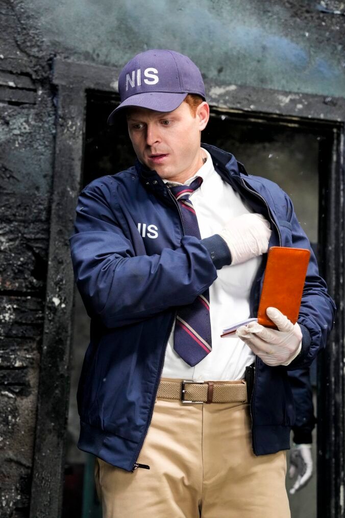 Randy Randolf gets out his notepad at a crime scene in NCIS Origins