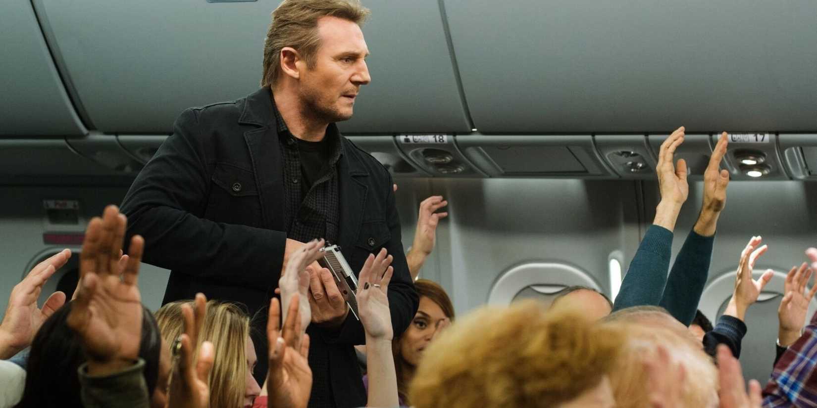 Liam Neeson with a gun on an airplane in Non-Stop