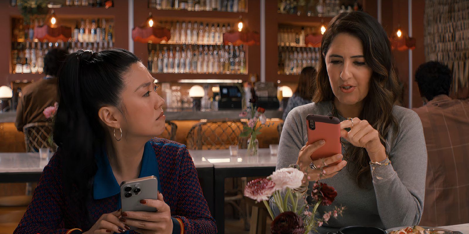 Ryann and Ashley look at their phones in Nobody Wants This episode 10