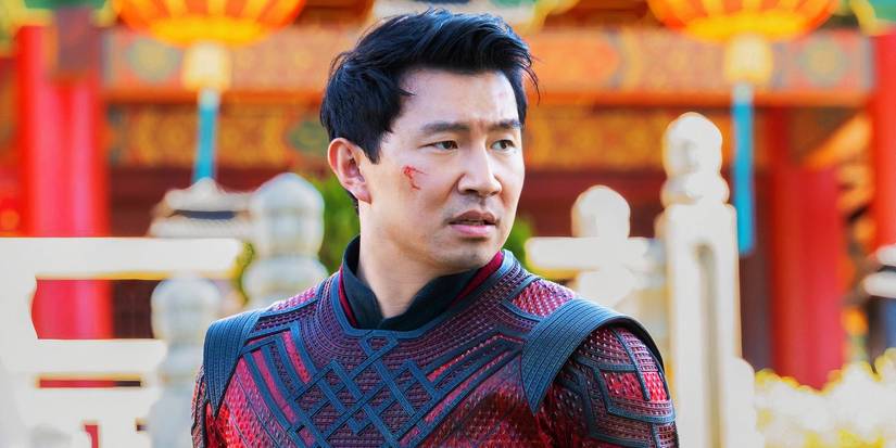 Shang-Chi protecting Ta Lo in Shang-Chi and the Legend of the Ten Rings