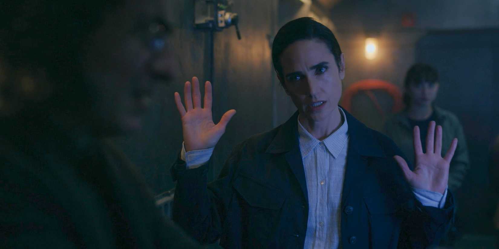 Melanie (Jennifer Connelly) with her hands up in Snowpiercer Season 4 Episode 10