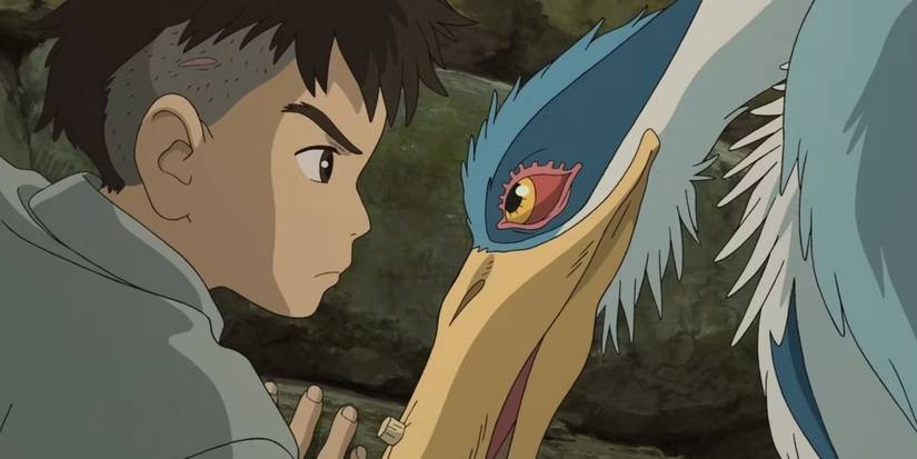 The Boy and the Heron by Hayao Miyazaki screencap of the two lead characters facing one another.