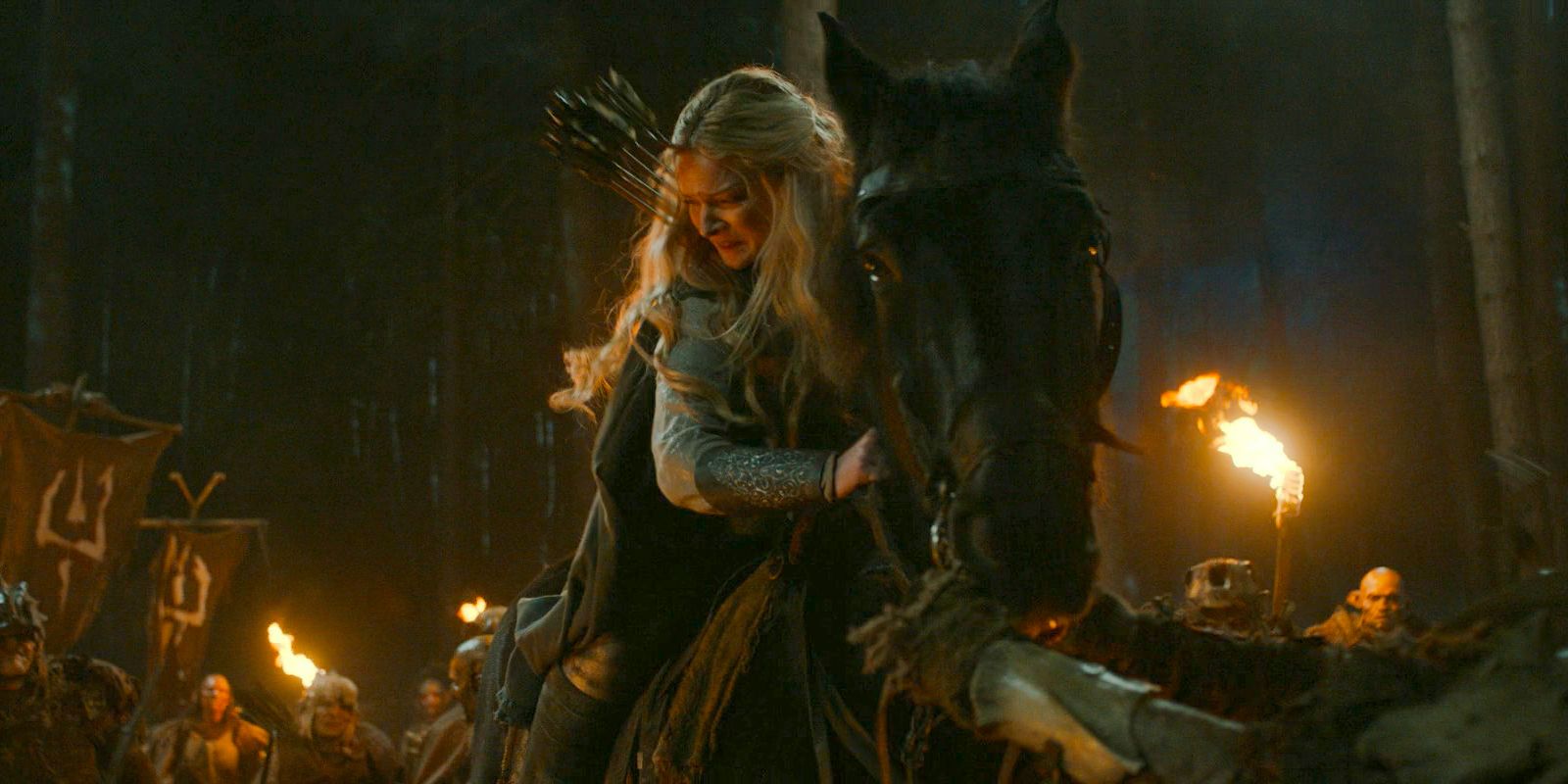 Galadriel (Morfydd Clark) on her horse, fighting against an army of orcs in The Lord of the Rings: The Rings of Power Season 2 Episode 4