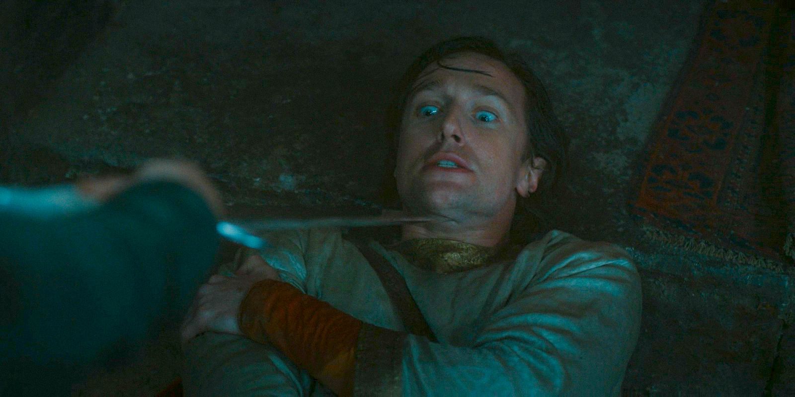 Kemen (Leon Wadham) being threatened with a sword by Valandil in The Lord of the Rings: The Rings of Power Season 2 Episode 5