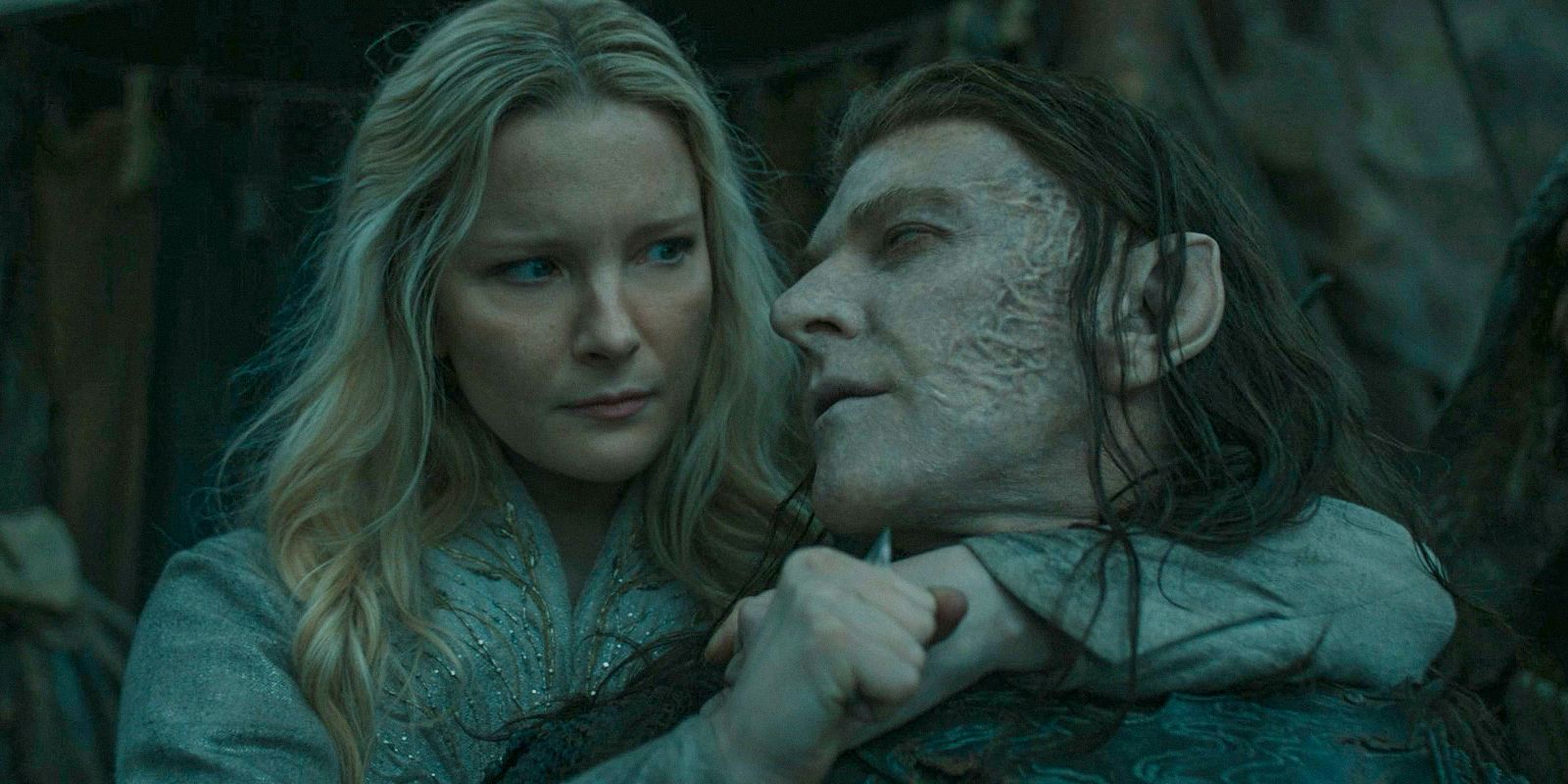 Galadriel (Morfydd Clark) holding a knife to Adar's (Sam Hazeldine) throat in The Lord of the Rings: The Rings of Power Season 2 Episode 5