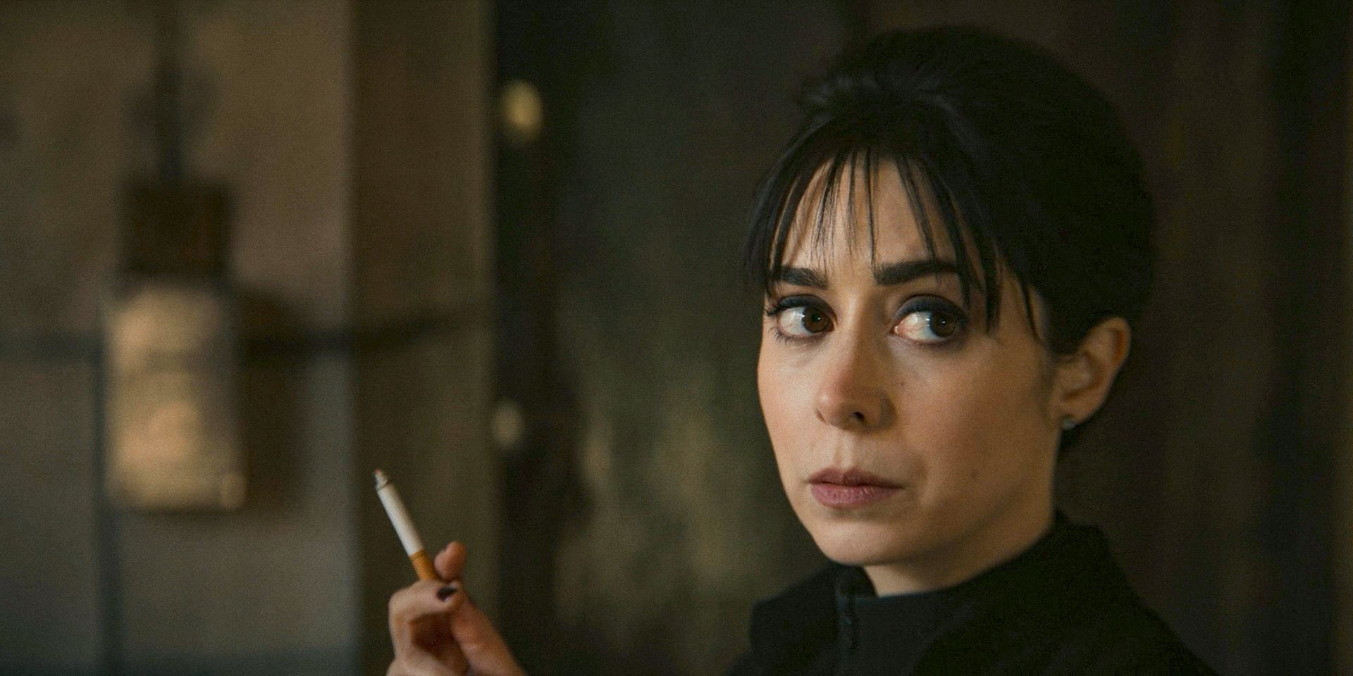 Sofia (Cristin Milioti) smoking and looking incredulous at Oz in The Penguin Season 1 Episode 2