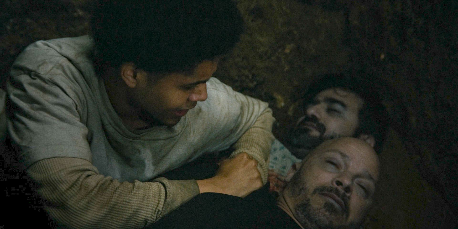 In a grave, Victor (Rhenzy Feliz) along with the bodies of Castillo and Ervad in The Penguin Season 1 Episode 2