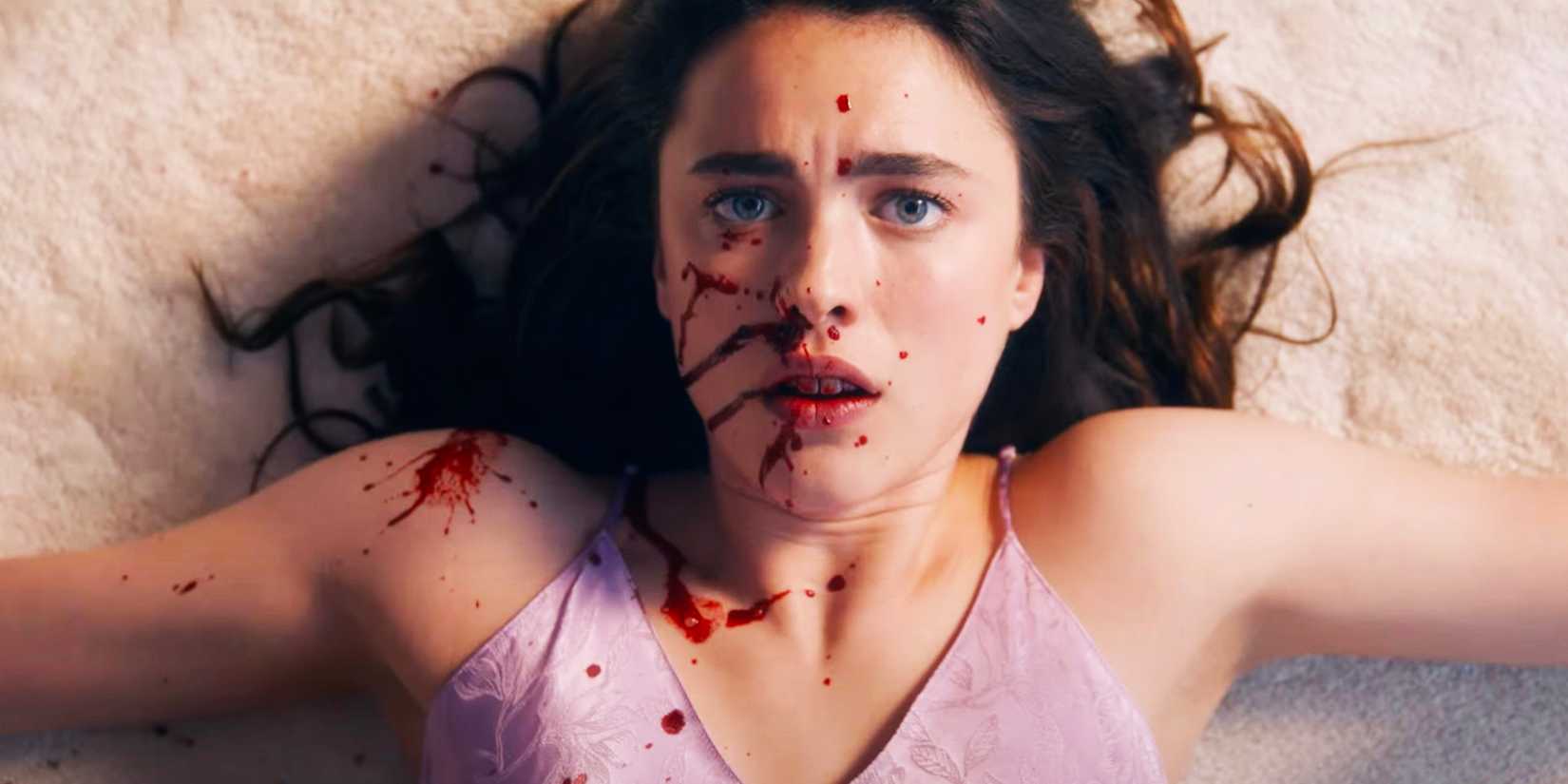 Margaret Qualley as Sue scared and on the floor with blood on her face in The Substance