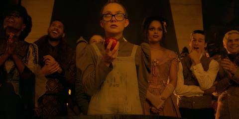 Mallory holding apple while the others look at her in American Horror Story Apocalypse 