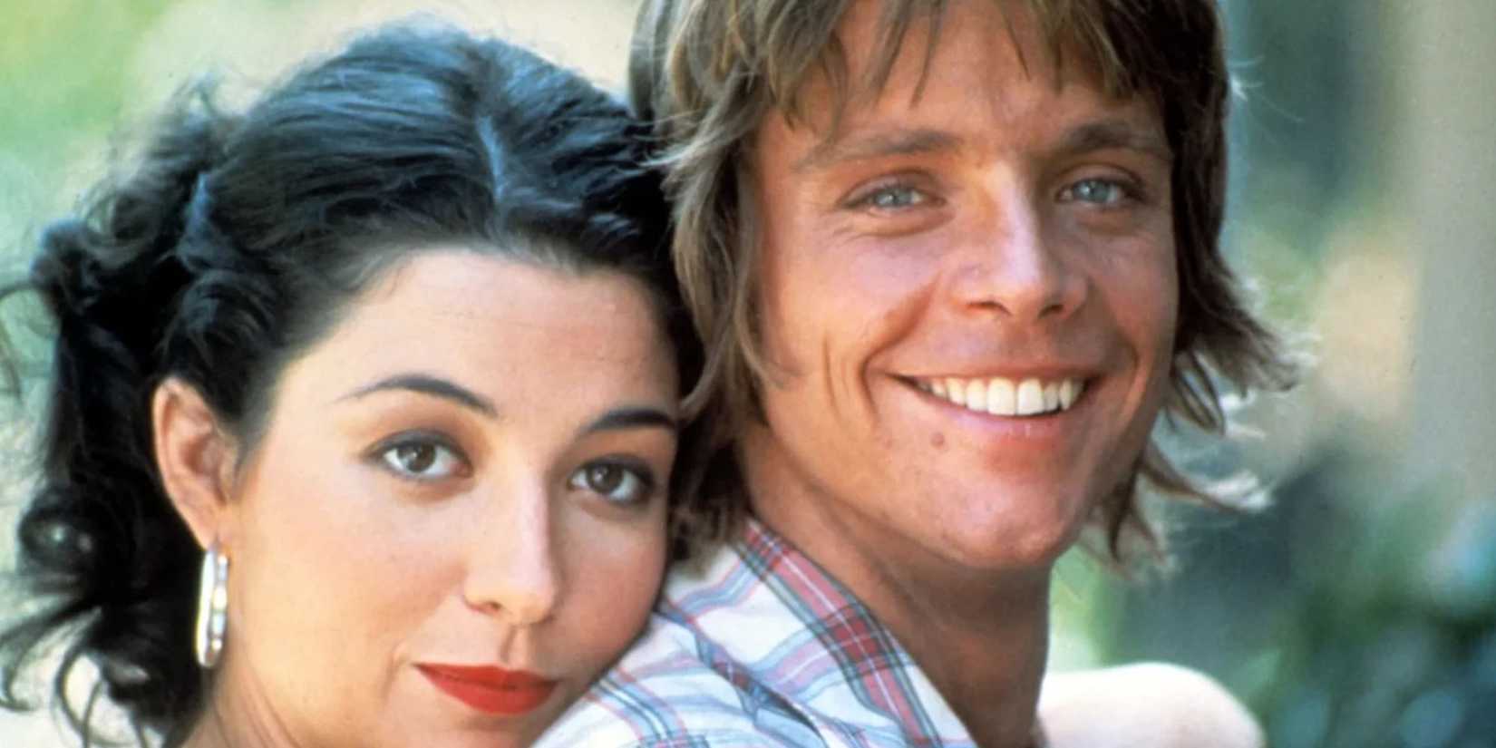 Annie Potts and Mark Hamill smiling as their Corvette Summer characters