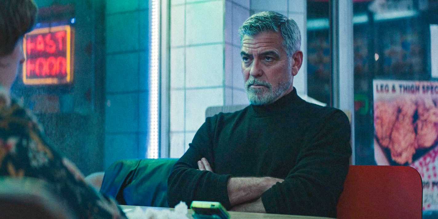 Margaret's Man (George Clooney) with his arms crossed in WOLFS