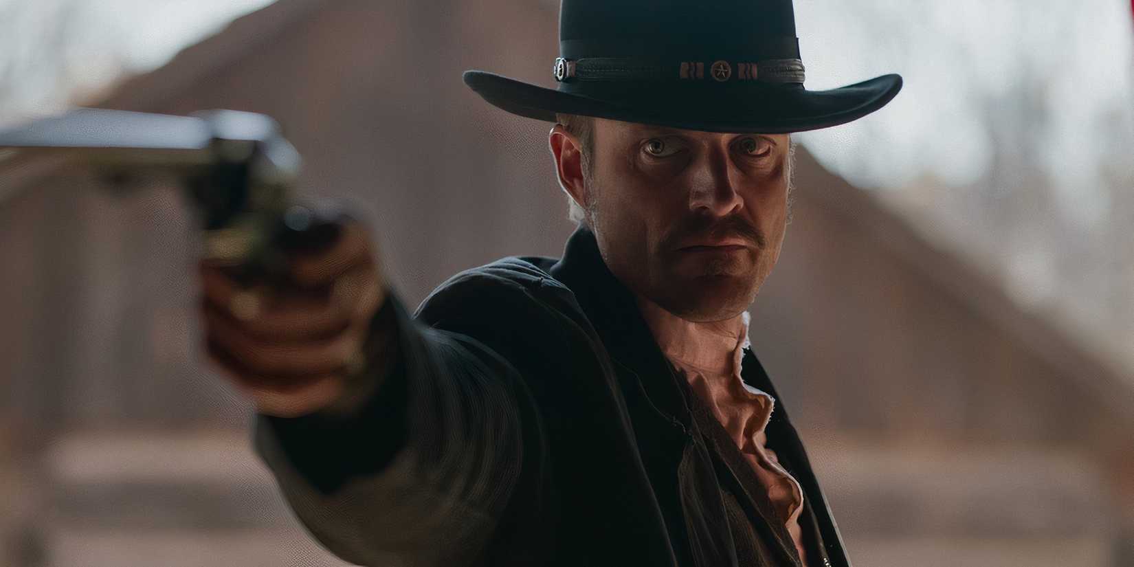 Tim Fellingham as Wyatt Earp pointing a gun in Wyatt Earp and the Cowboy War