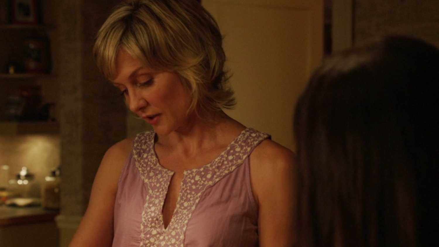 Linda and Erin talk in the kitchen while making Sunday dinner