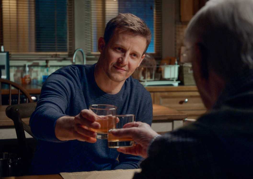 Blue Bloods Jamie clinking glasses with Henry who is seen from the back