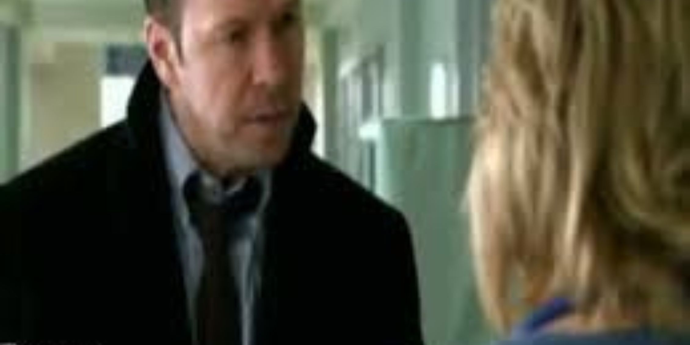 Blue Bloods Danny in suit and tie talking to Linda at hospital