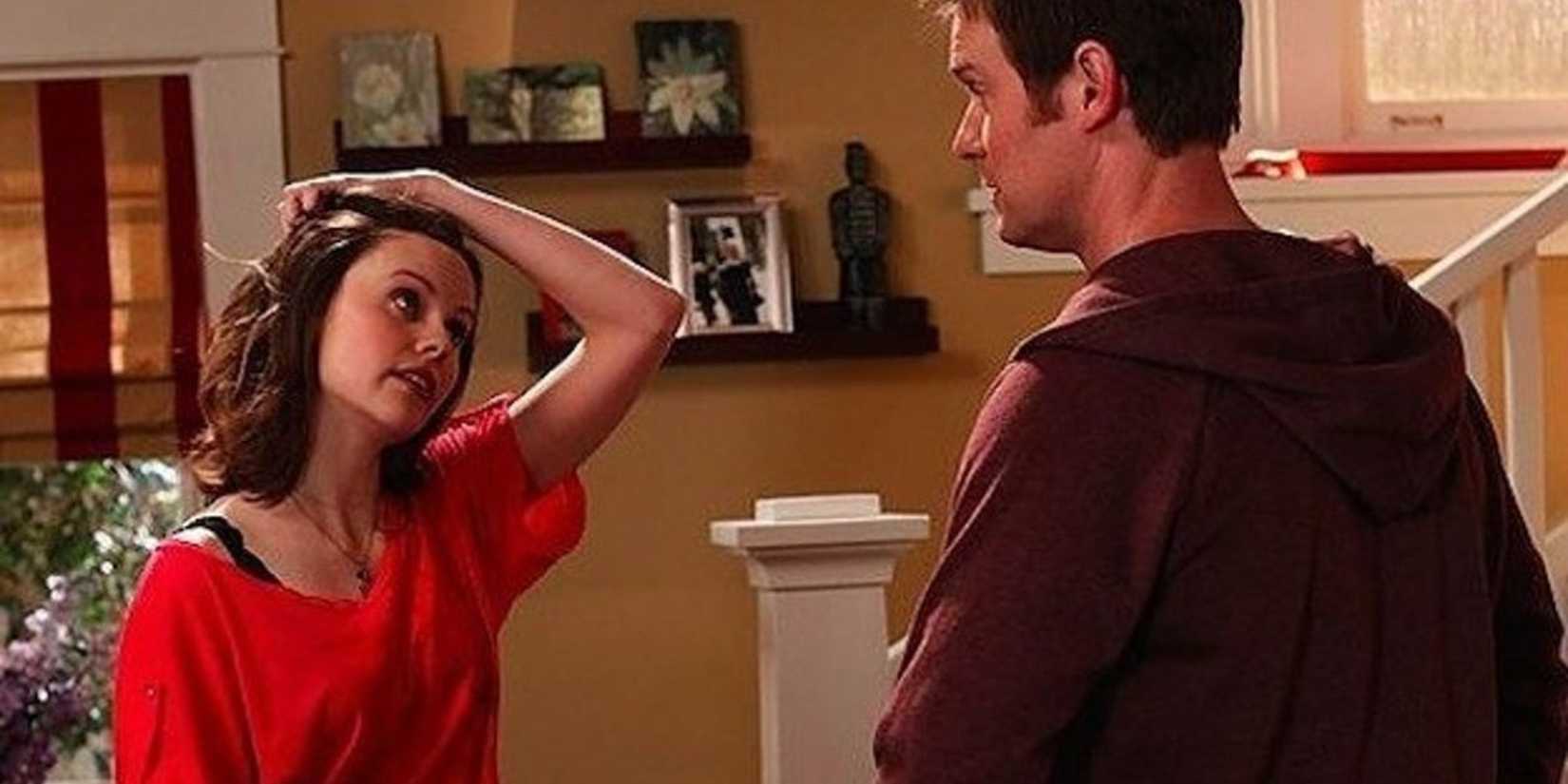 Parenthood Haddie standing facing Adam and running her hand through her hair in an exasperated manner