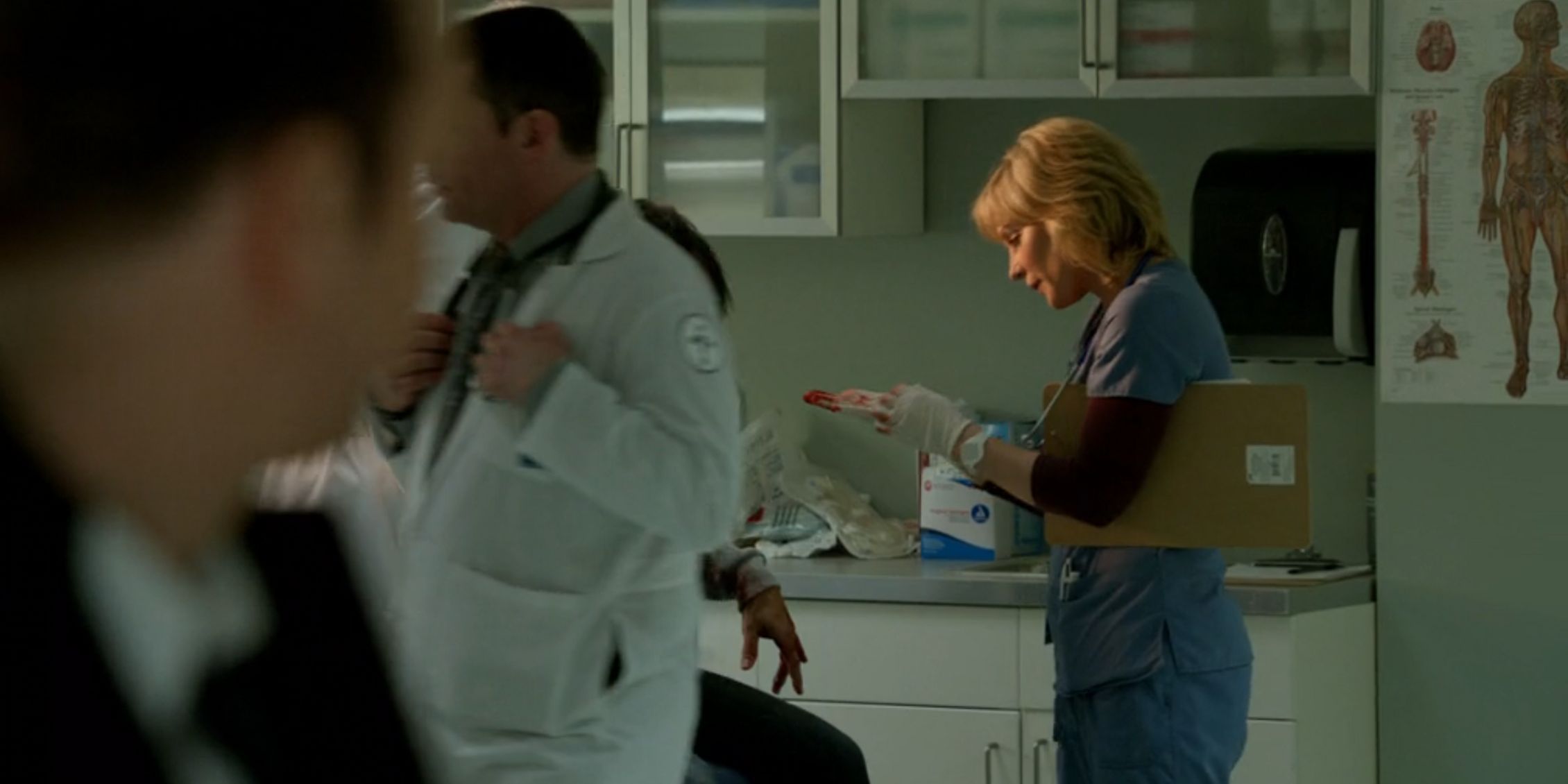 Blue Bloods Danny watches as Linda takes off her bloody hospital gloves