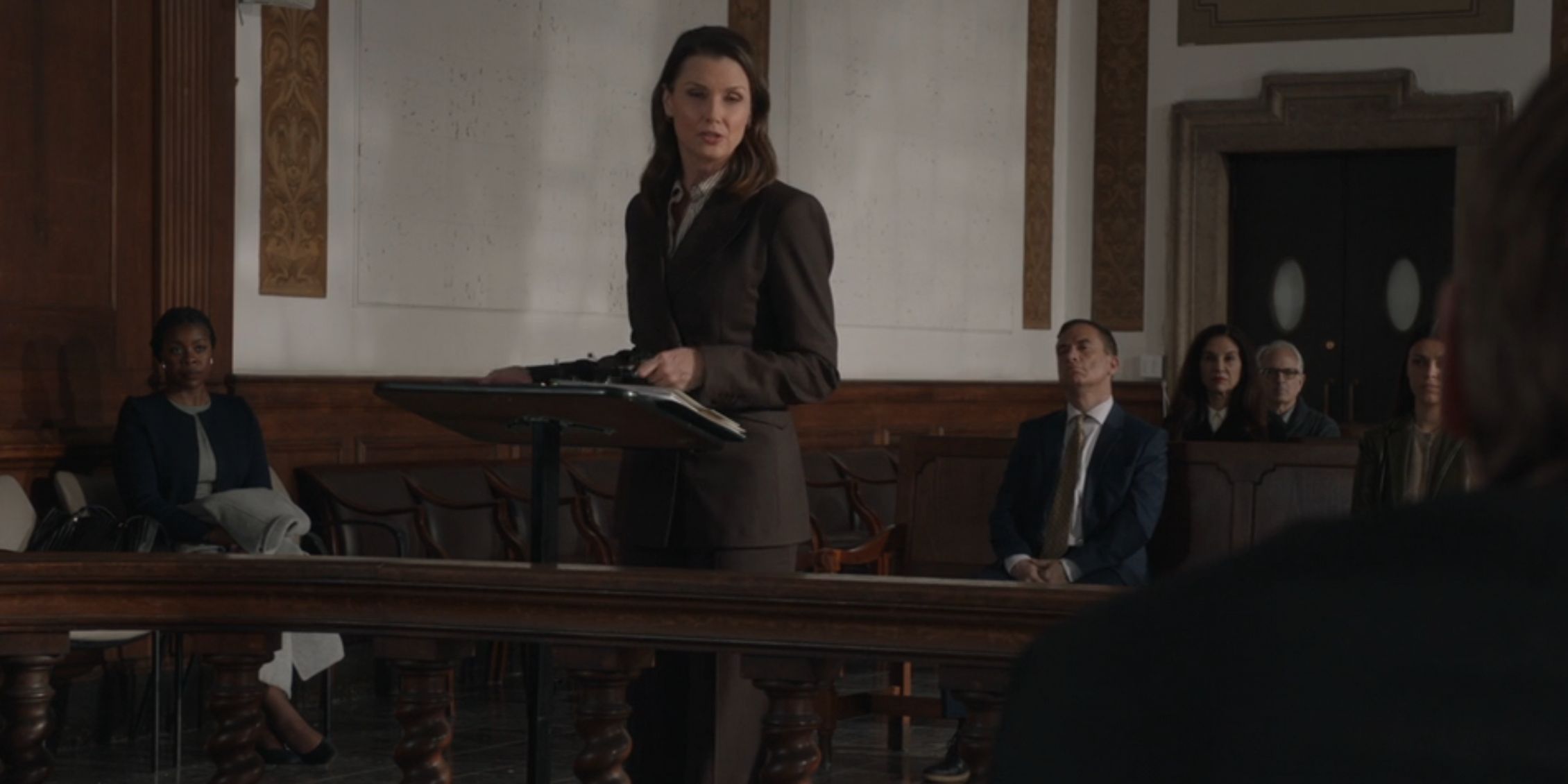 Blue Bloods Erin at a podium in a courtroom presenting her case