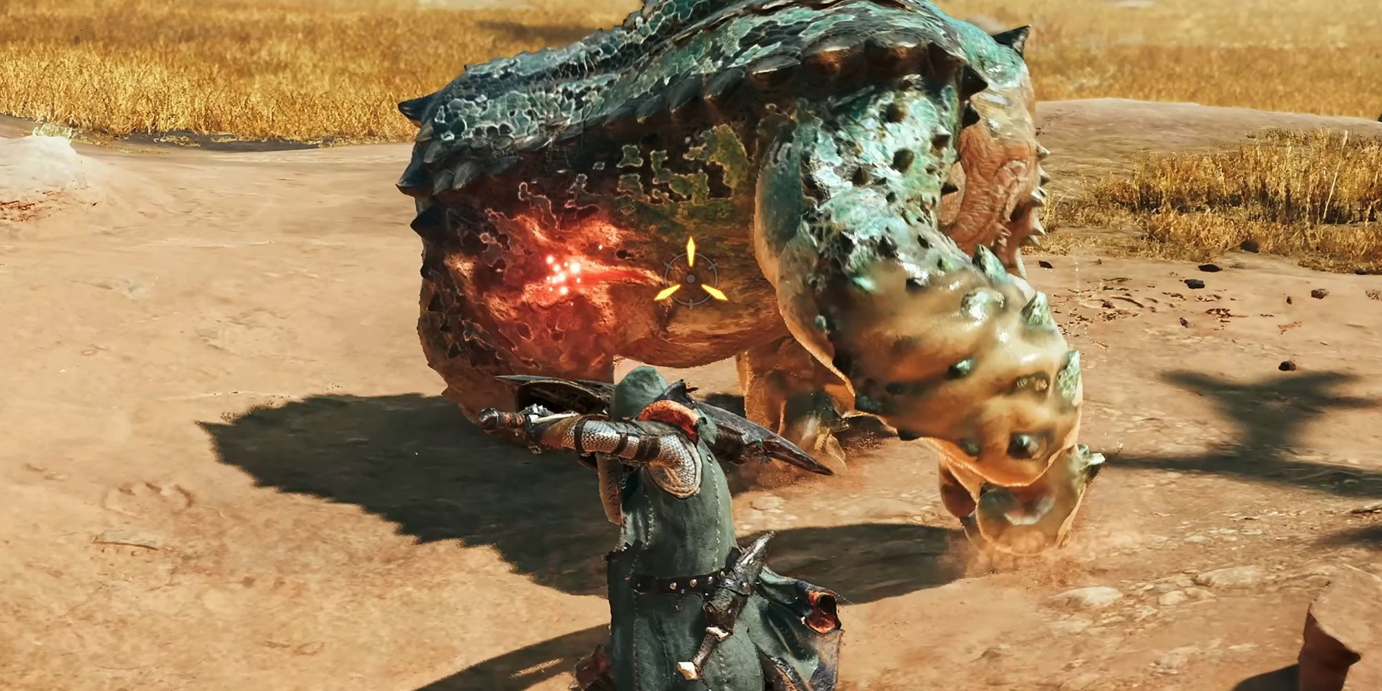 A player character aiming at a chatacabra in Monster Hunter Wilds. A part of its body is glowing red, indicating a wound.