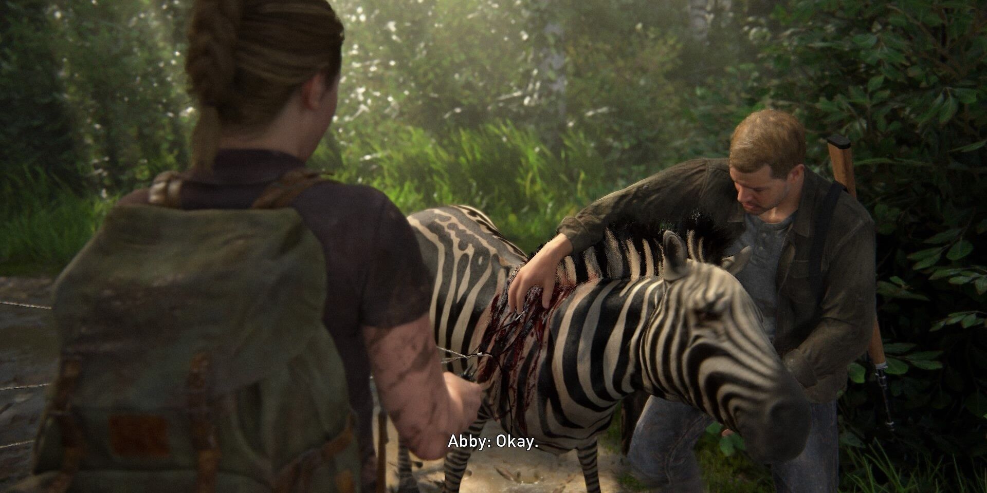 Abby and Jerry helping a zebra in The Last of Us Part II